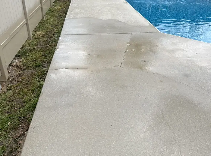 Pool deck concrete cleaned back to an even gray, Franklin County TN