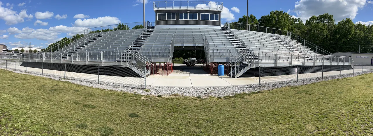 The full bleacher stand and press box washed clean at a school football field