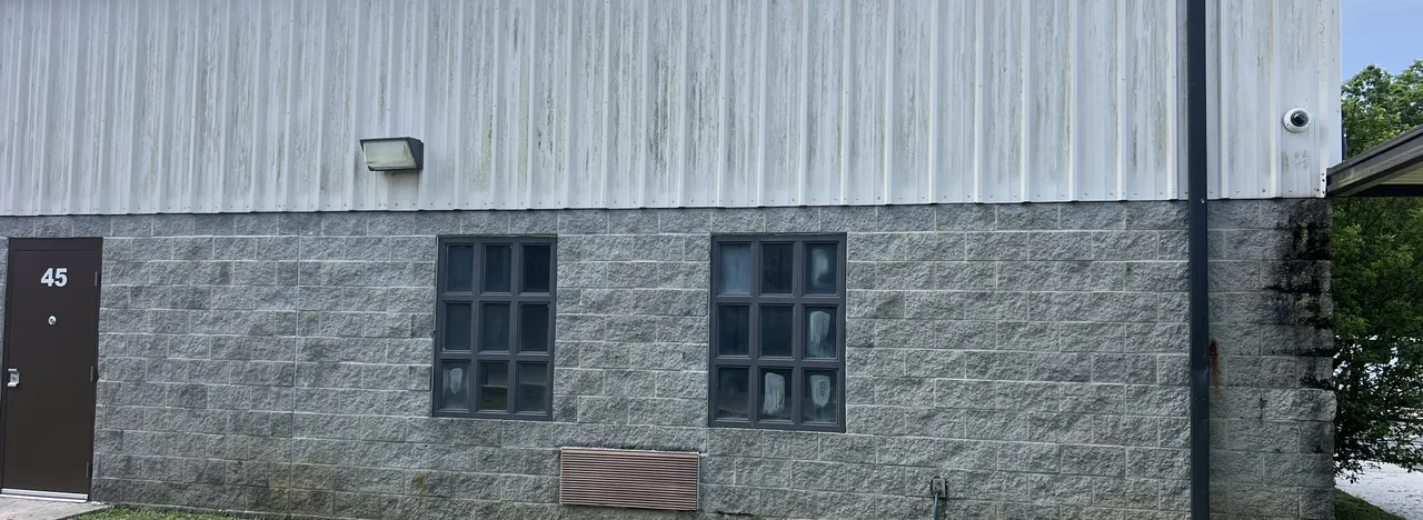 Block and metal commercial building after a full wash down