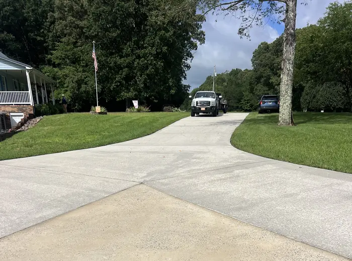 Concrete driveway cleaned back to a bright even finish