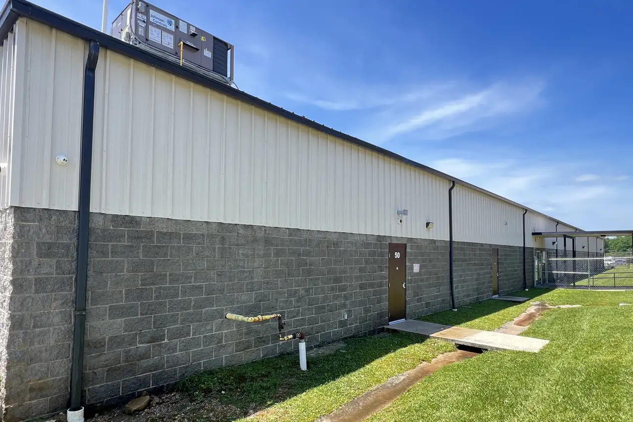 Commercial metal building and its concrete apron after a wash down